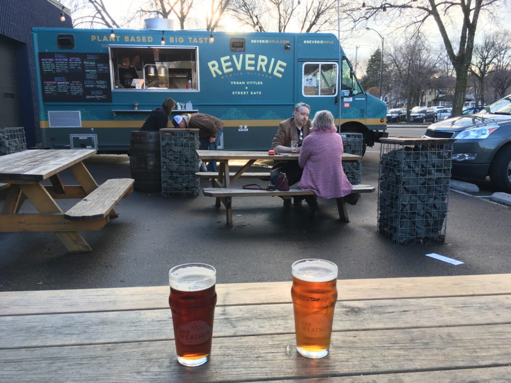 Two beers and a food truck